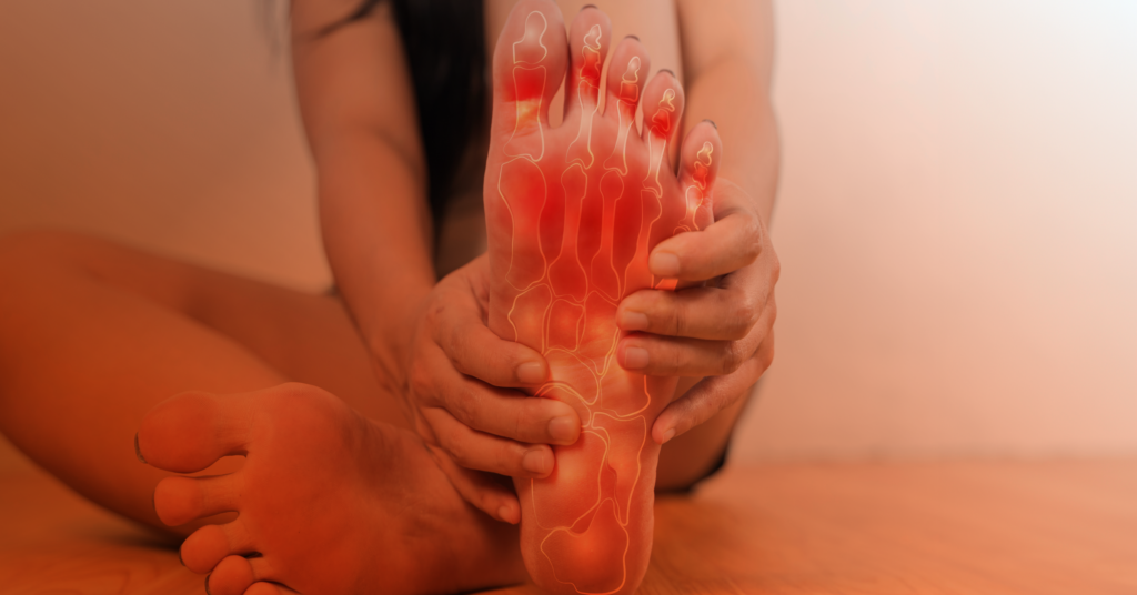 person holding foot with arthritis pain