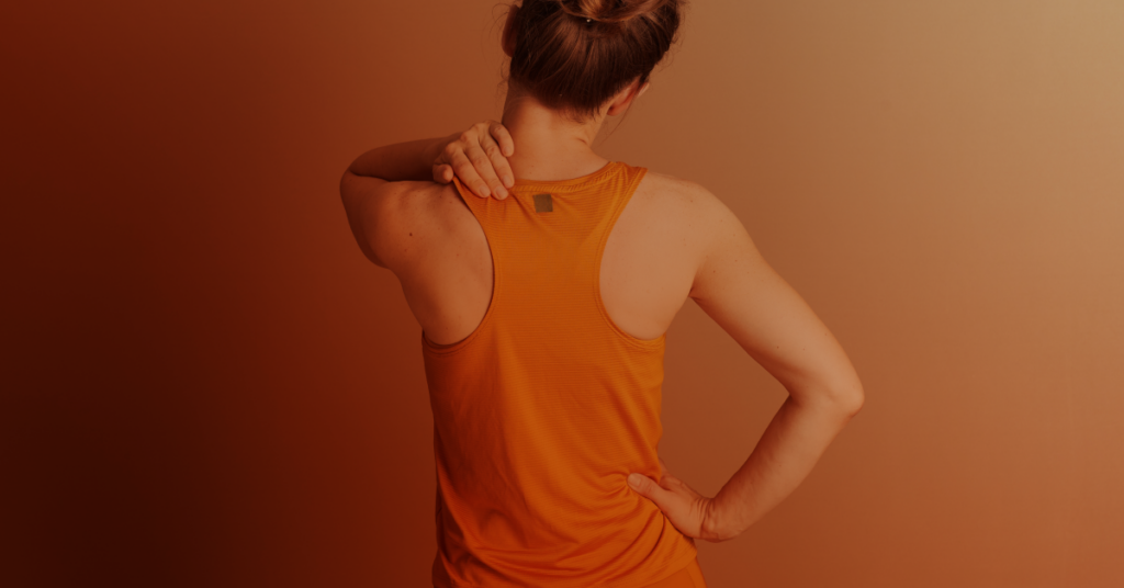 Woman experiencing neck pain.