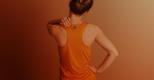 Woman experiencing neck pain.