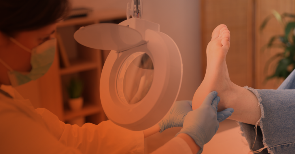 Doctor looking at foot